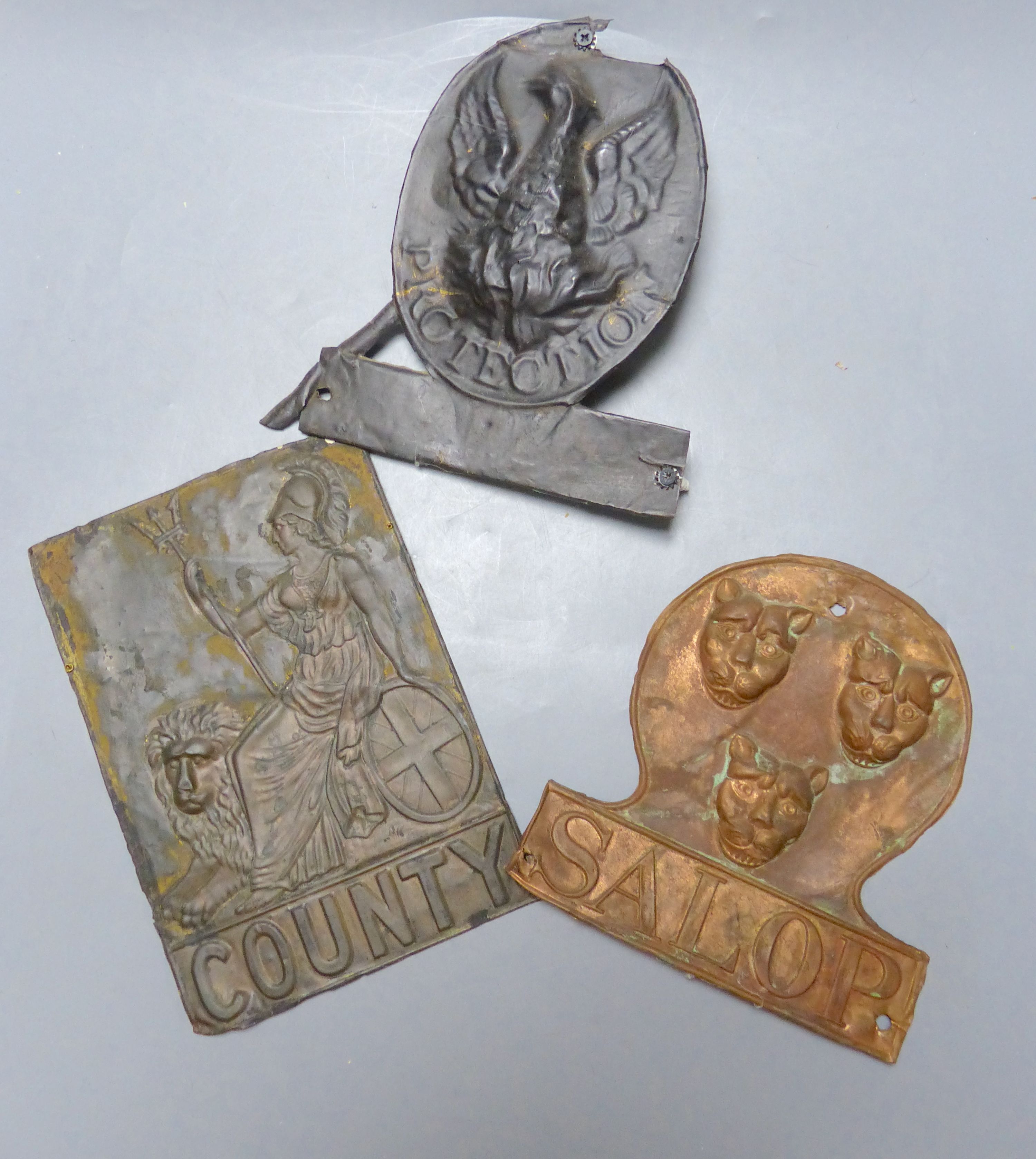 Three embossed tinplate fire marks - 'County' 'Salop' and 'Eagle'